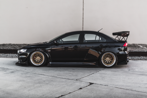 side view of black EVO X with Custom Wide Body Kit