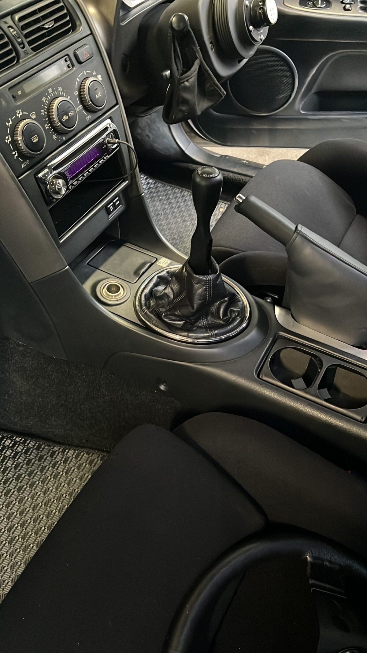 Black IRP Short Shifter installed in a car