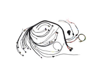 An automotive wiring harness kit with multiple black-wrapped wires, various connector types, and small attached components, laid out on a plain white background.