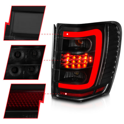 Lanternas traseiras de LED ANZO 1999-2004 Jeep Grand Cherokee com barra de luz preta com lentes fumê