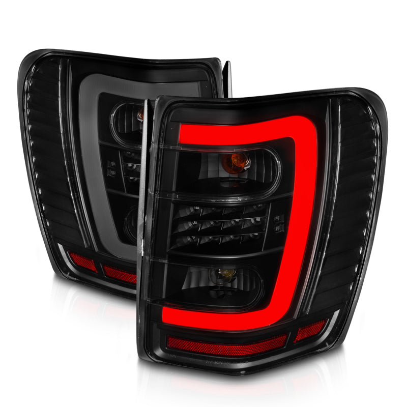 Lanternas traseiras de LED ANZO 1999-2004 Jeep Grand Cherokee com barra de luz preta com lentes fumê