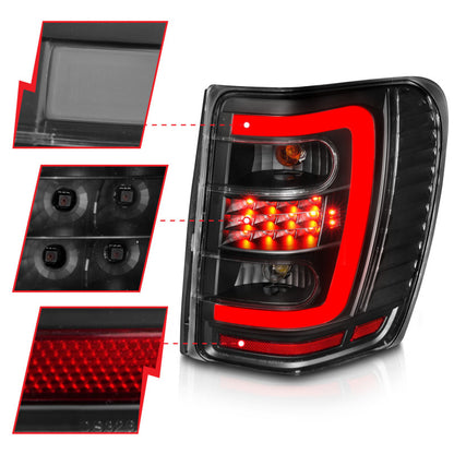 Lanternas traseiras de LED ANZO 1999-2004 Jeep Grand Cherokee com barra de luz preta com lentes transparentes