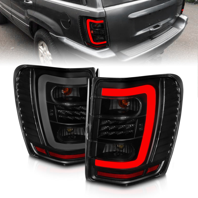 Lanternas traseiras de LED ANZO 1999-2004 Jeep Grand Cherokee com barra de luz preta com lentes fumê