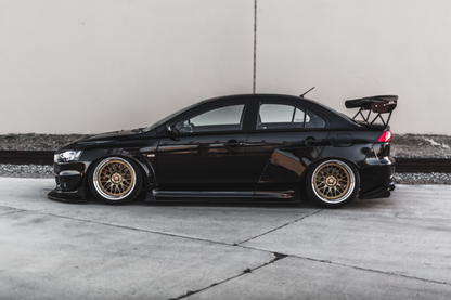 side view of black EVO X with Custom Wide Body Kit