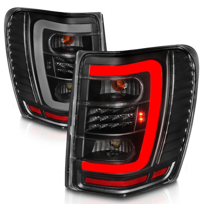 Lanternas traseiras de LED ANZO 1999-2004 Jeep Grand Cherokee com barra de luz preta com lentes transparentes
