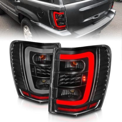 Lanternas traseiras de LED ANZO 1999-2004 Jeep Grand Cherokee com barra de luz preta com lentes transparentes
